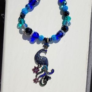 Stunning peacock 🦚 pendant on 19" necklace. Earrings included ✨️